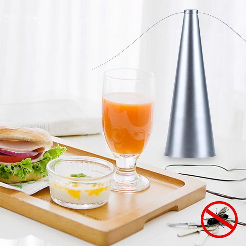 Lifestyle shot of the fly trap gadget on a stylish outdoor dining setup