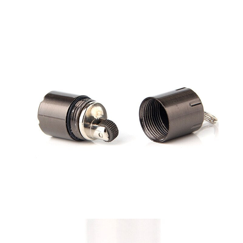 Detailed view of the mini lighter's metallic finish and keychain attachment