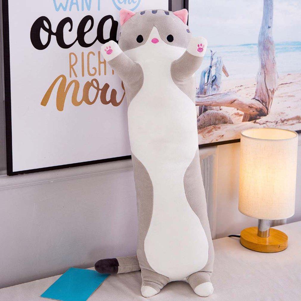 Person hugging the long cat plush pillow on a sofa for comfort