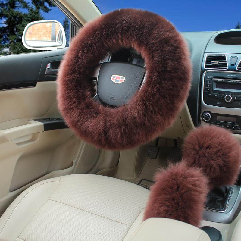 Person holding the plush steering wheel cover showing its flexibility