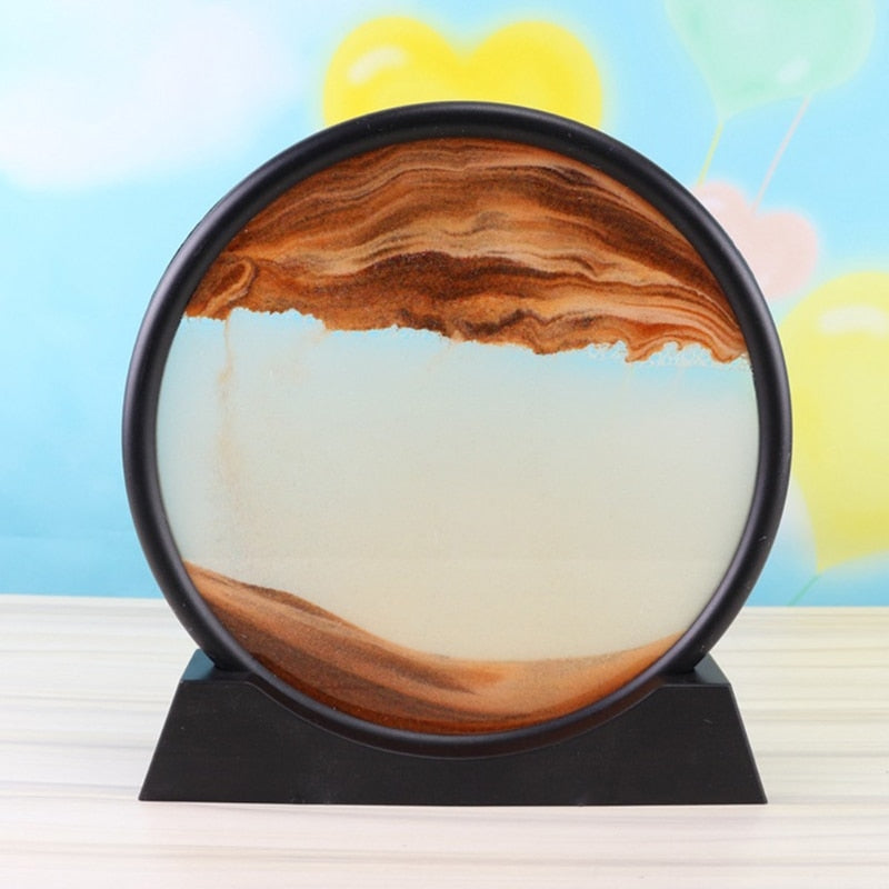 Flowing sand art piece on a wooden desk
