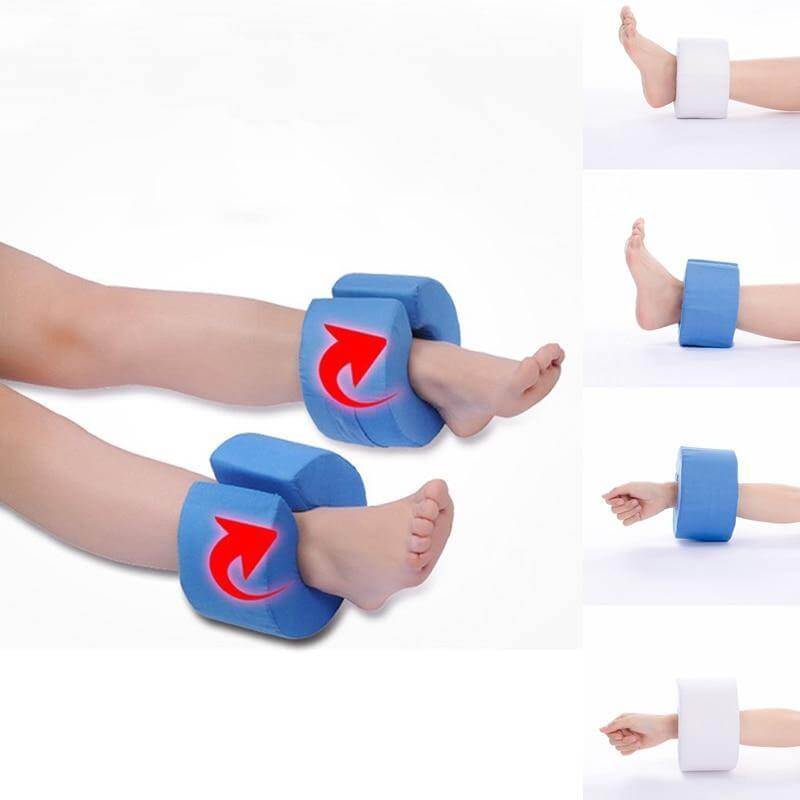 A person using the support pillow to elevate their foot in bed