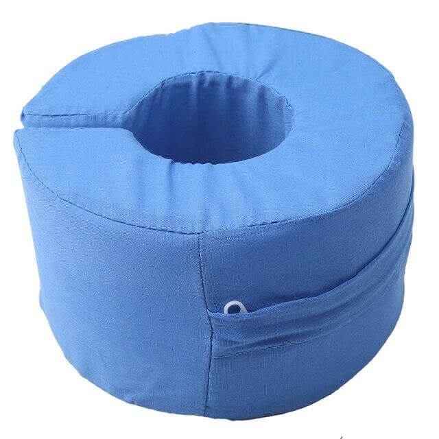 The foot and ankle support pillow in use on a chair