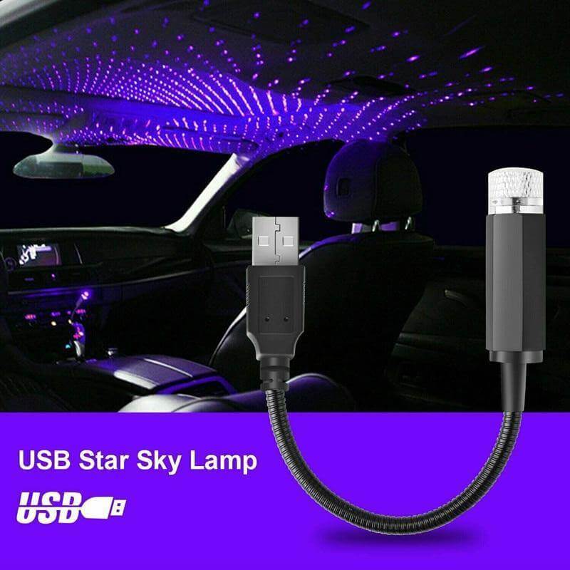 Blue star projector lighting up the interior of a car