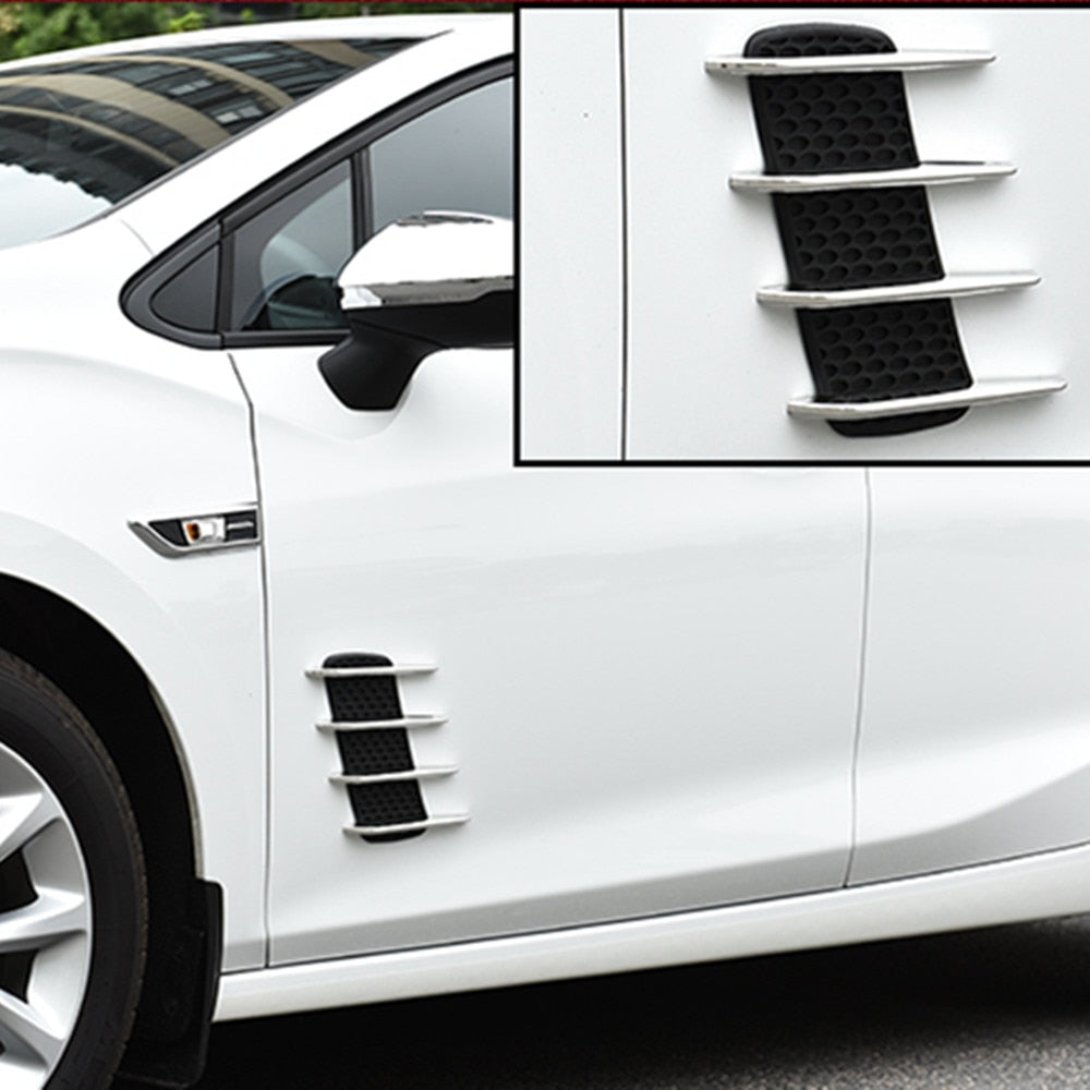 Car Vent Decoration Sticker in chrome finish applied to a white car fender
