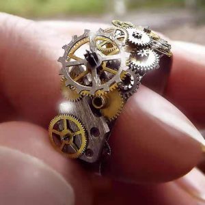 Intricate gold-plated mechanical unisex ring with moving parts