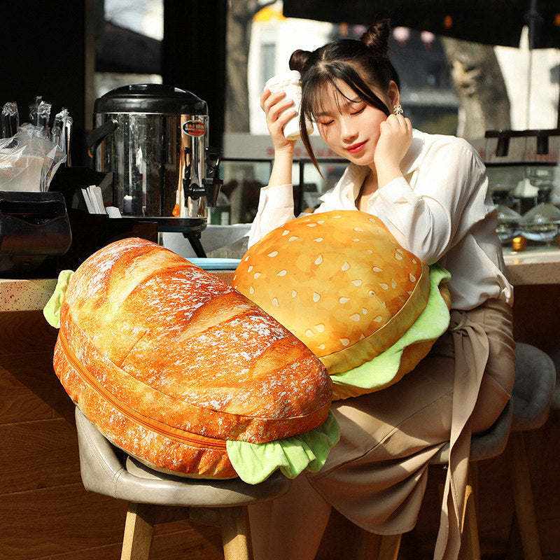 Using the hamburger pillow as a comfortable seat cushion on a chair