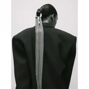 Elegant hyperbole silver long tassel ponytail hair accessory draped on a ponytail