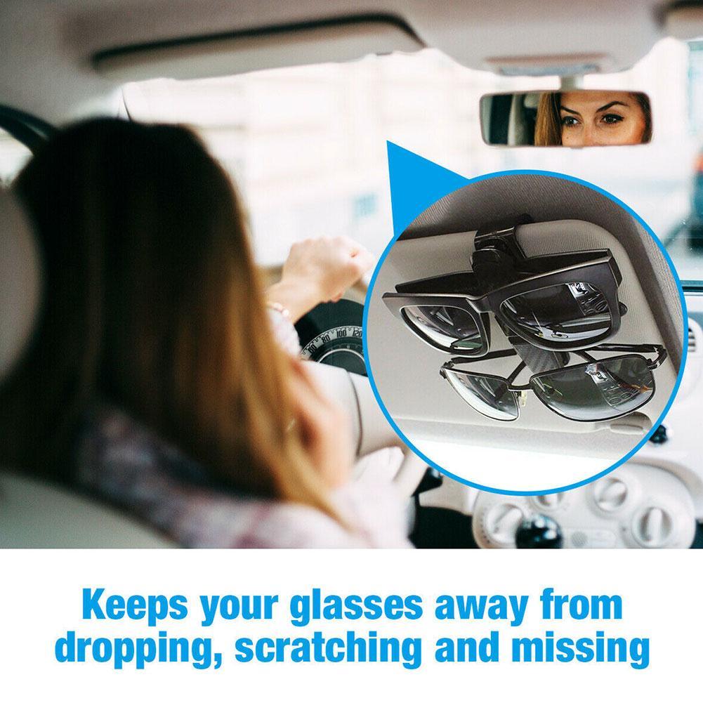 Close-up of the glasses holder clip's secure grip on a car sun visor