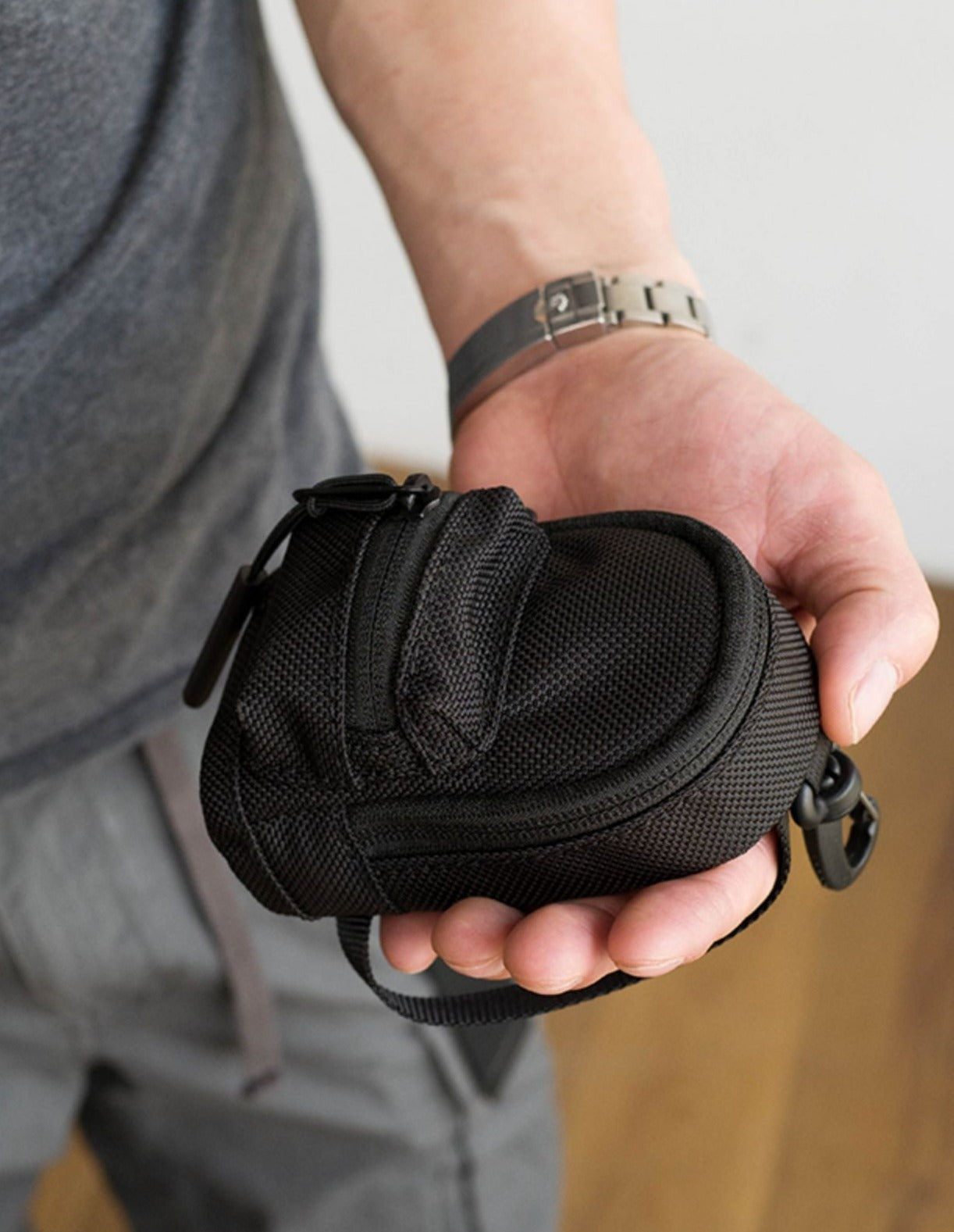 Detail shot of the mini backpack coin purse's zipper and material