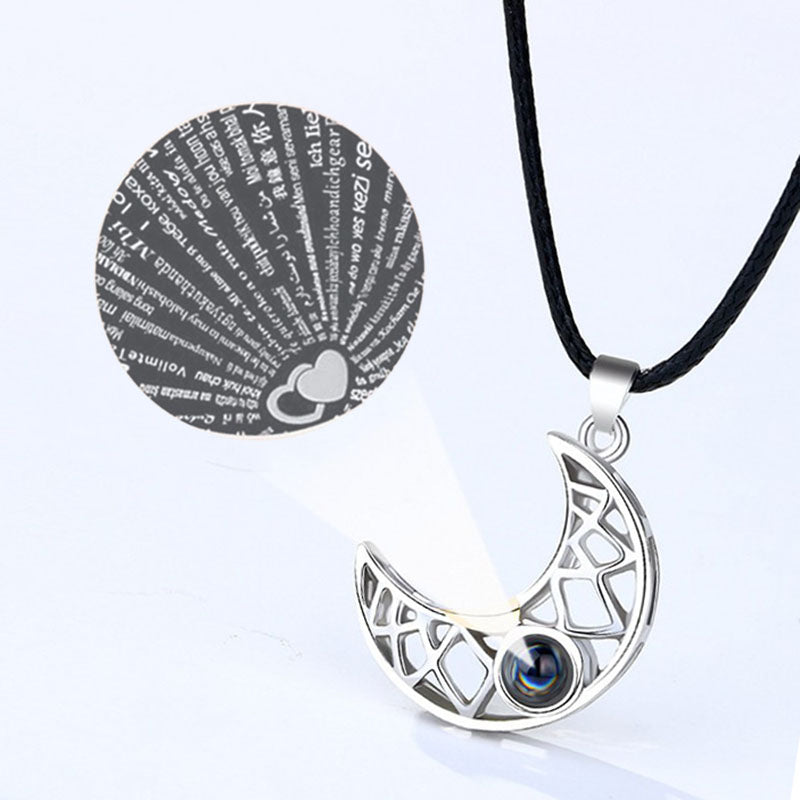 The two necklace pendants displayed separately, one with a sun design and one with a moon