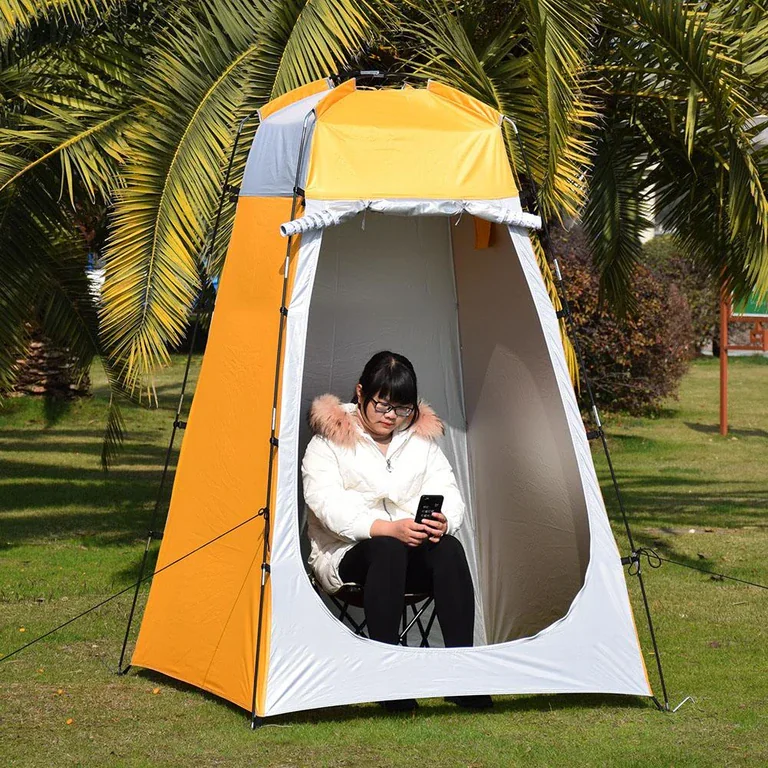 Compact, portable privacy shelter set up outdoors, ideal for changing or showering