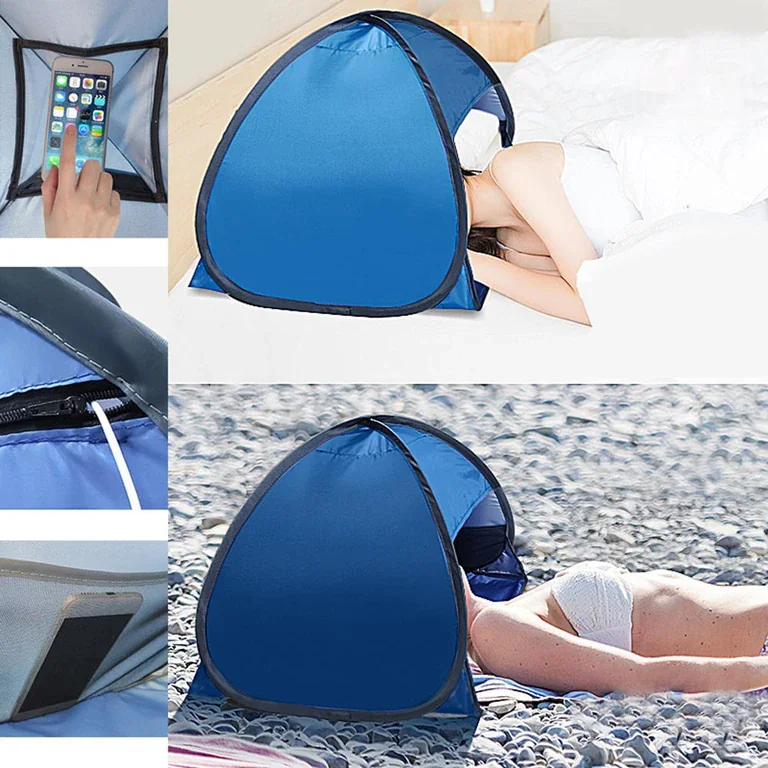 Lightweight, portable sun shield canopy set up on a beach, offering instant shade