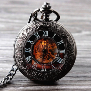 Vintage-style black pocket watch with Roman numerals and engraved patterns