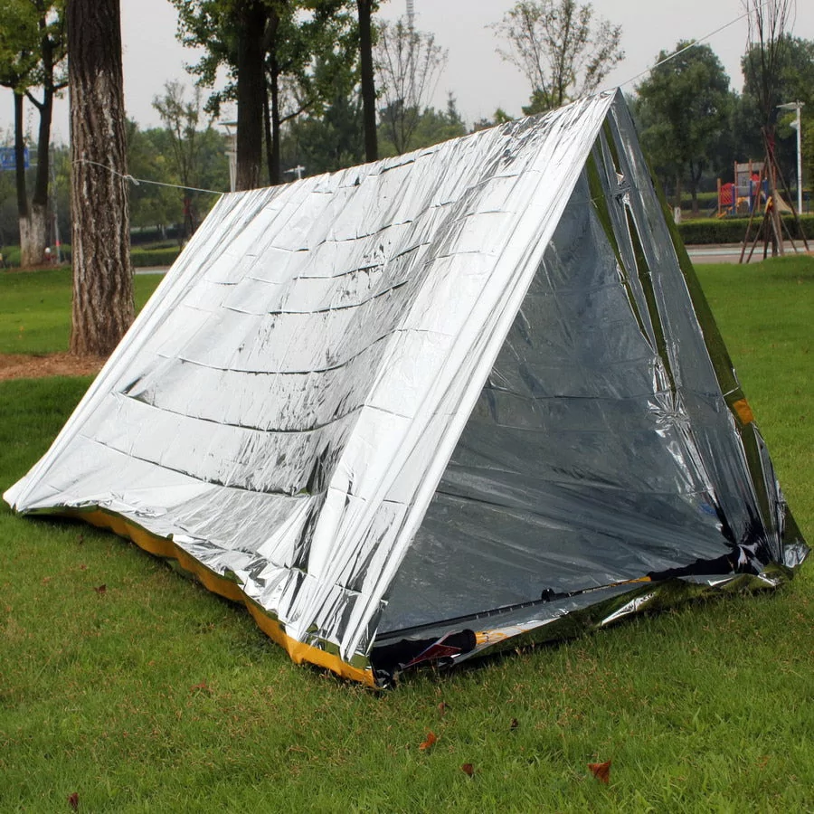 Compact emergency sleeping bag or blanket shelter, folded for portability