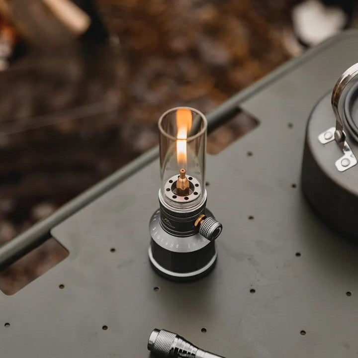 The Mountain Peak Campsite Lamp shown with its included protective case