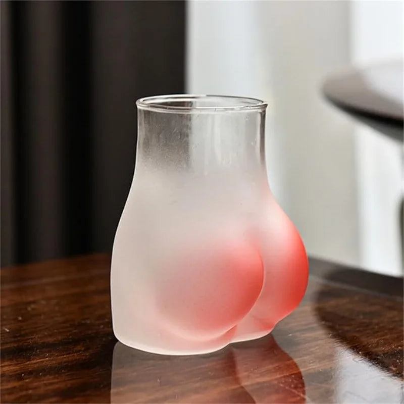Holding the quirky sculpted cocktail glass