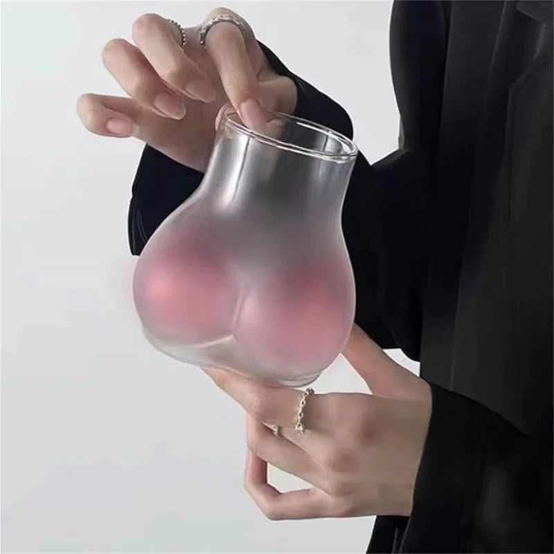 Holding the Pink Butt Cocktail Mug to show its size and grip