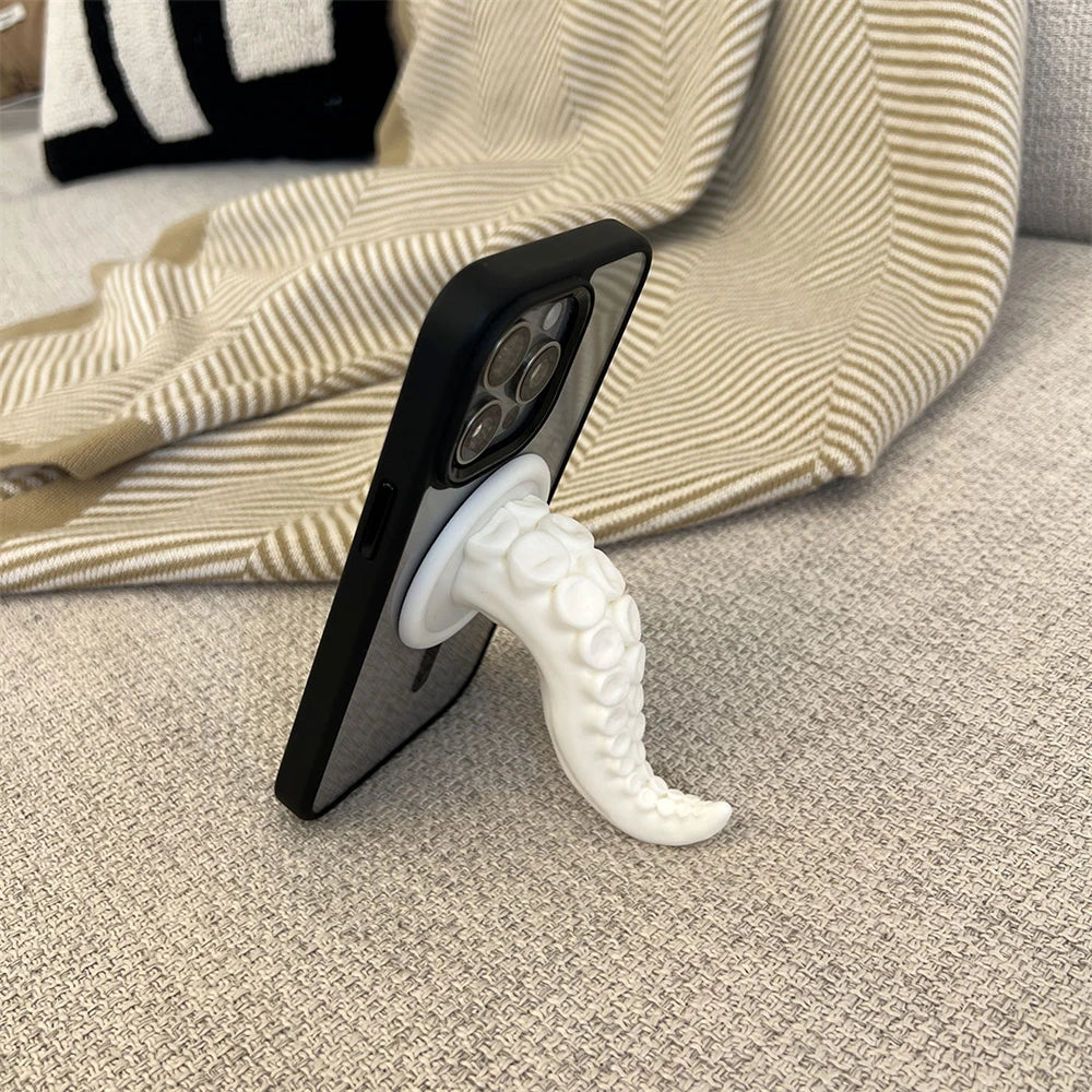 Person holding a phone securely with the octopus tentacle phone grip