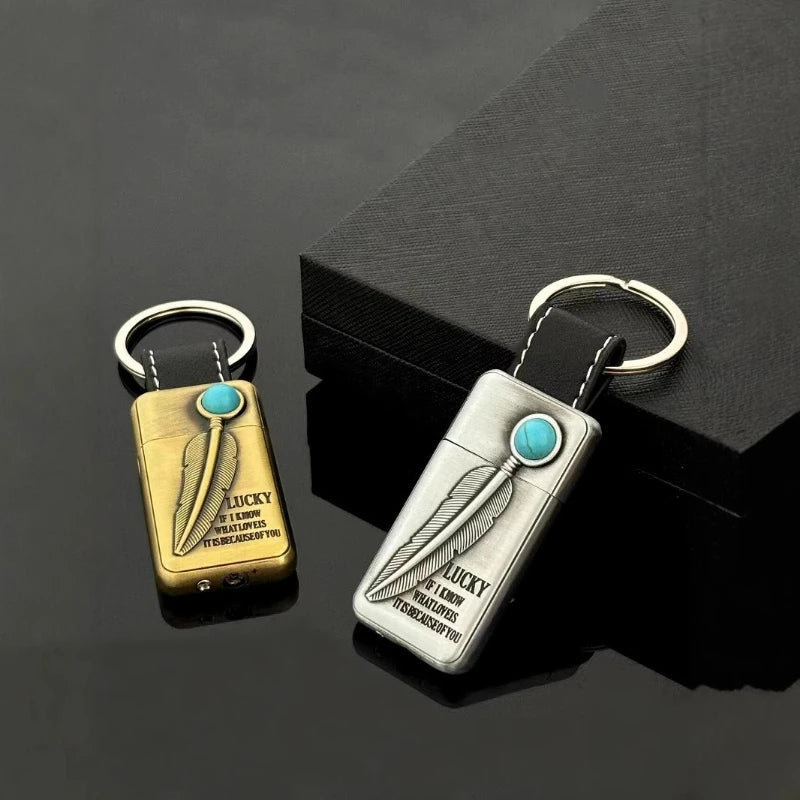 The vintage keychain lighter held in hand, showing its size and portability