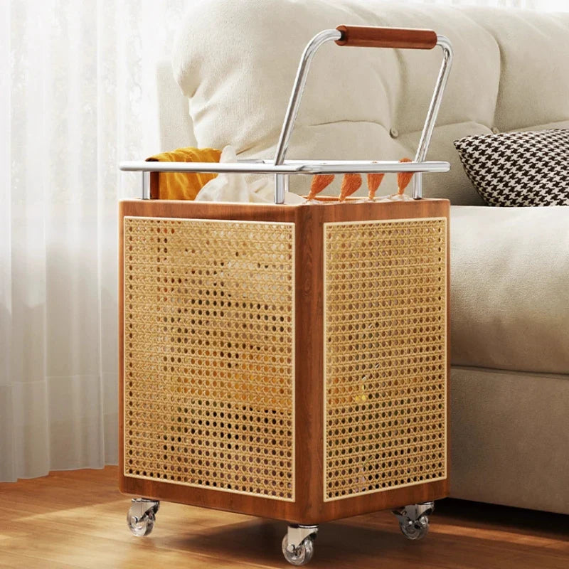 Side profile of the rattan storage basket highlighting its wooden handles and texture