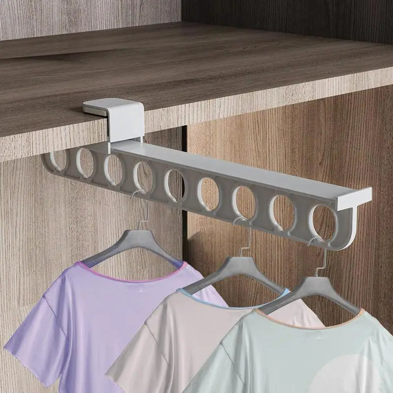 Detailed view of the retractable closet hanger rack's smooth sliding mechanism