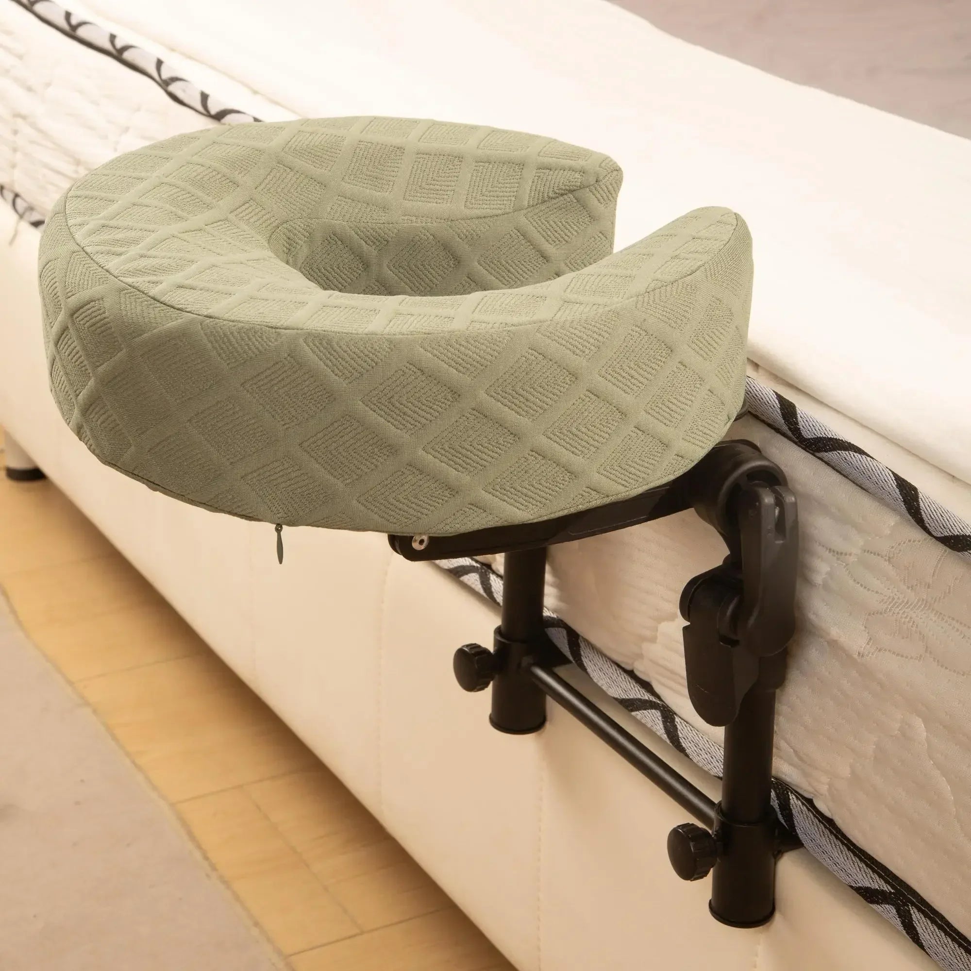 A person enjoying a comfortable back massage using the bed-mounted face bracket