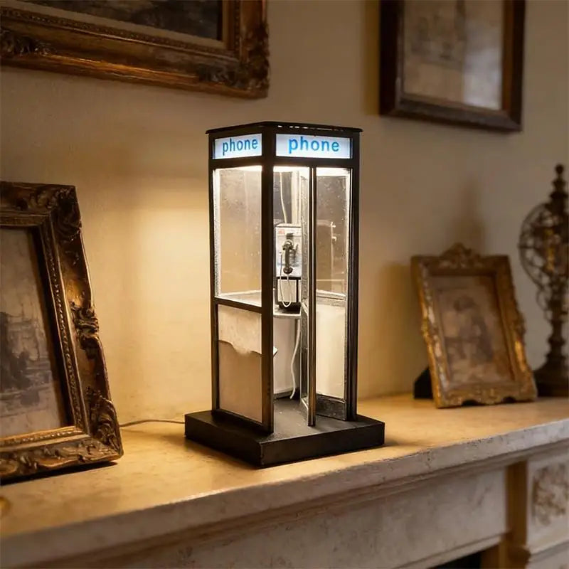 A person holding the compact retro telephone booth lamp
