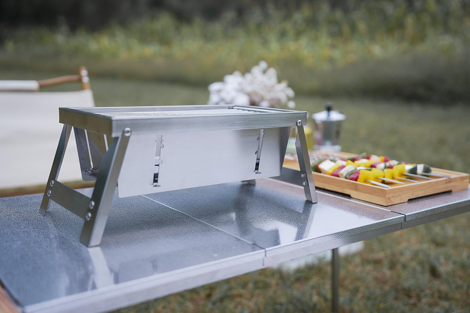 The compact and portable grill shown in its folded state