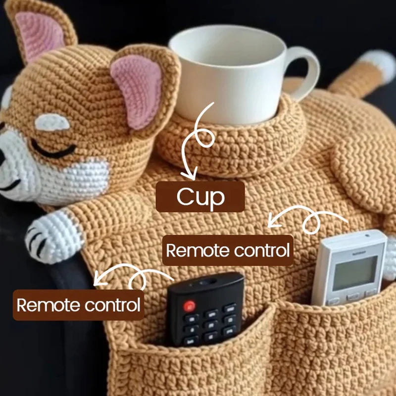 Close-up of the SitBoy organizer holding a remote and a phone on a sofa
