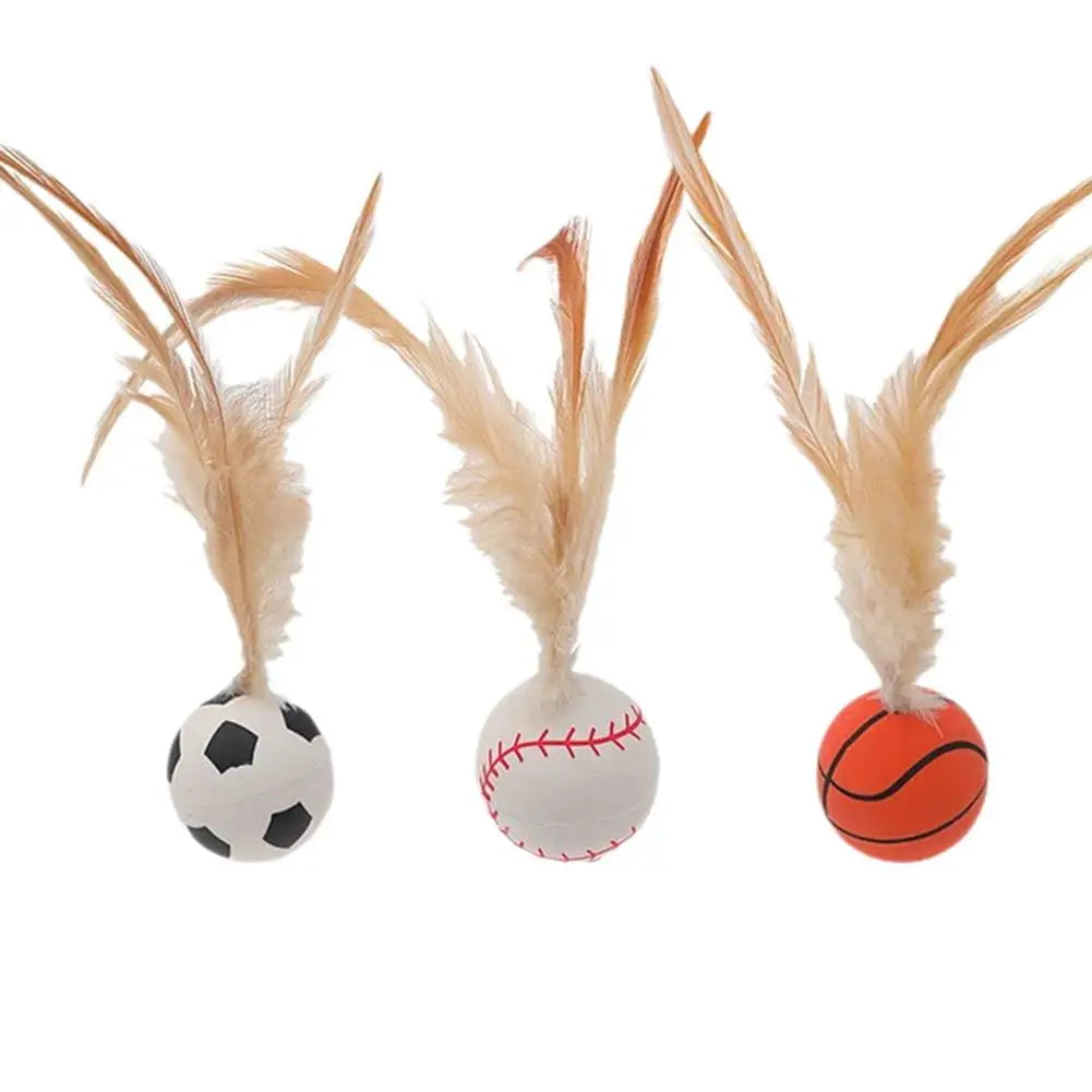 A cat curiously sniffing the Feather Ball Cat Teaser Interactive Toy