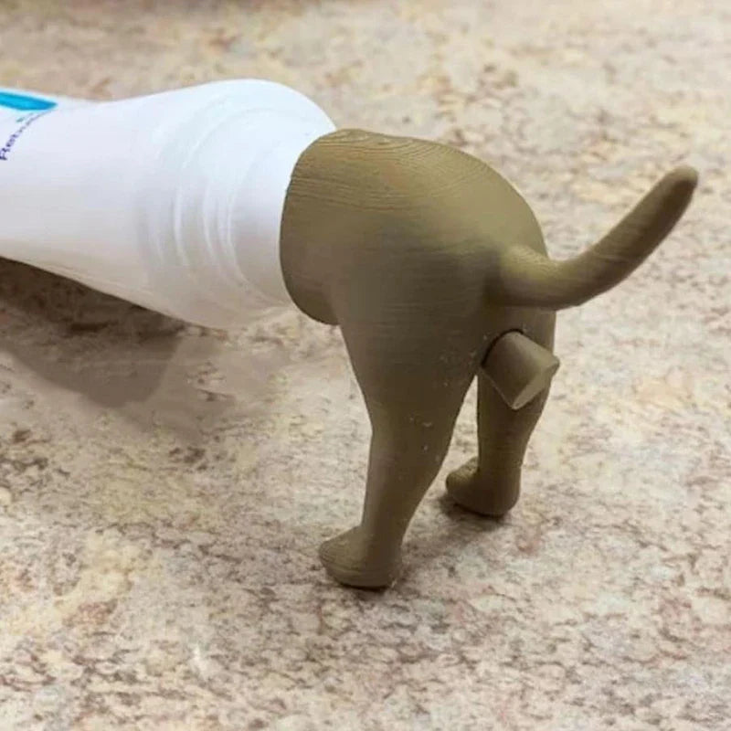 Funny dog butt toothpaste dispenser in a bathroom setting