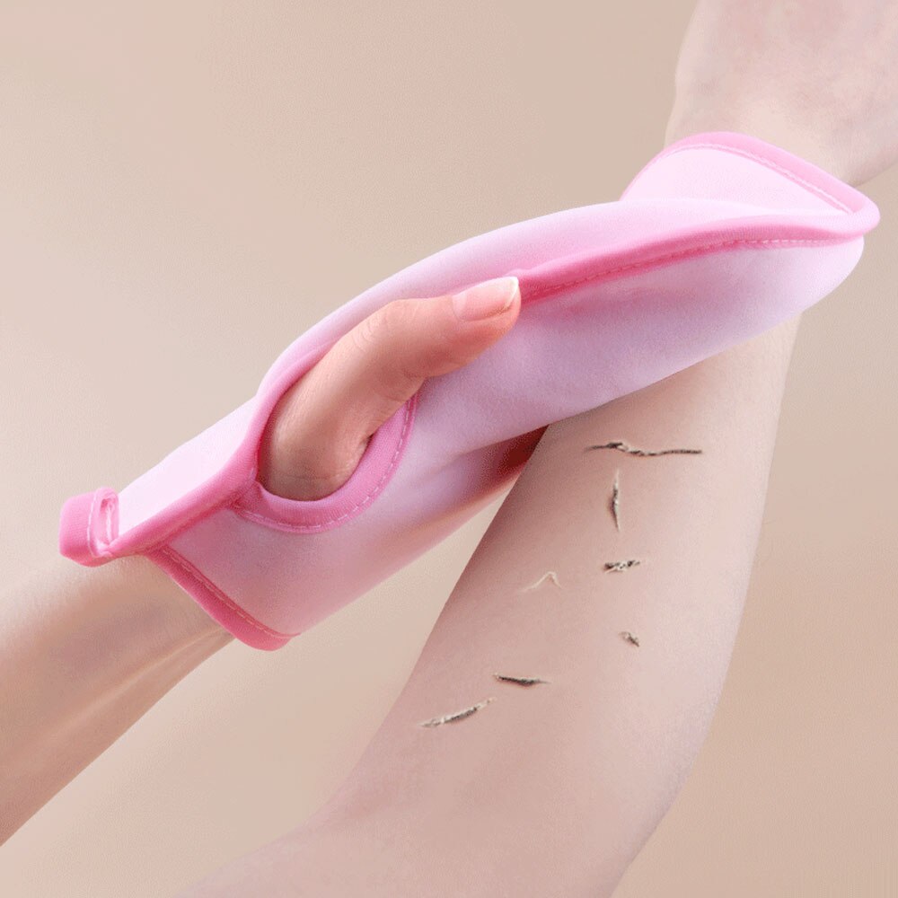 Gentle Touch Soft Dead Skin Remover Glove held in hand