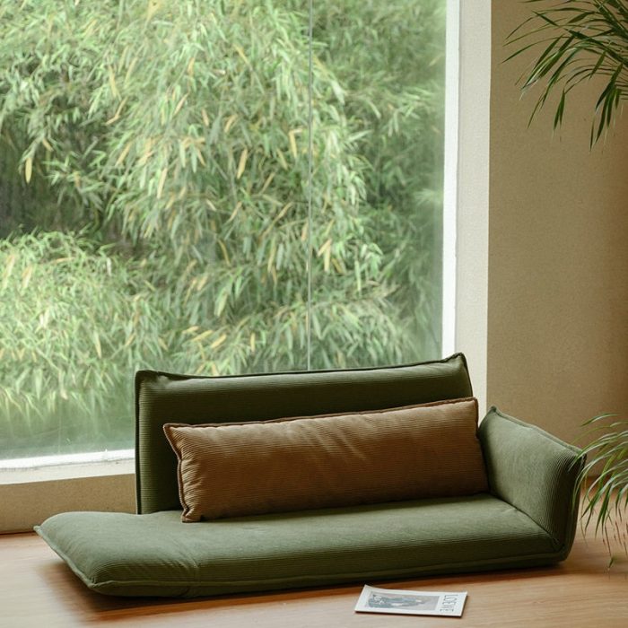 Versatile adjustable Japanese style floor sofa in a minimalist living room