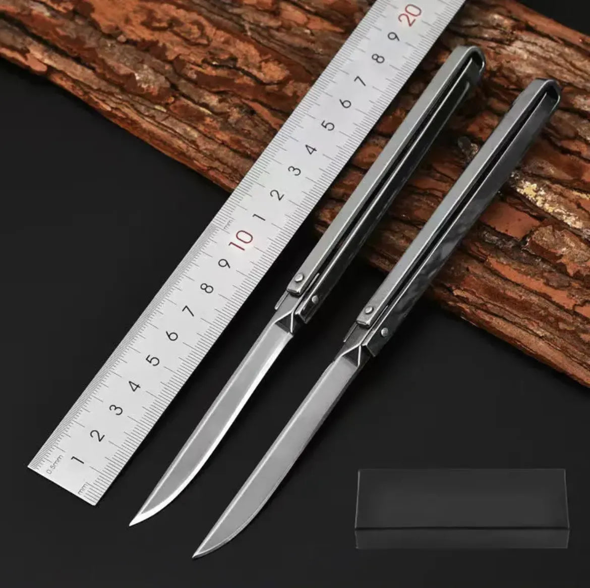 Mini Ranger Edge foldable camping knife shown in hand for scale