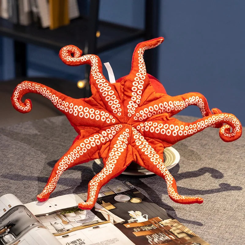 Unique Red Octopus Plush Stuffed Toy gift idea sitting on a bed