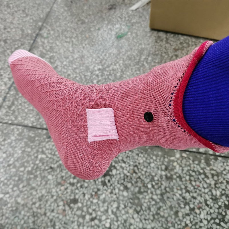 Four different animal-themed knitted socks including crocodile, fish, and shark.