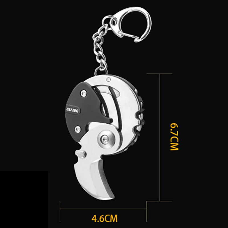 Close-up of the mini saw and knife on the keychain survival tool