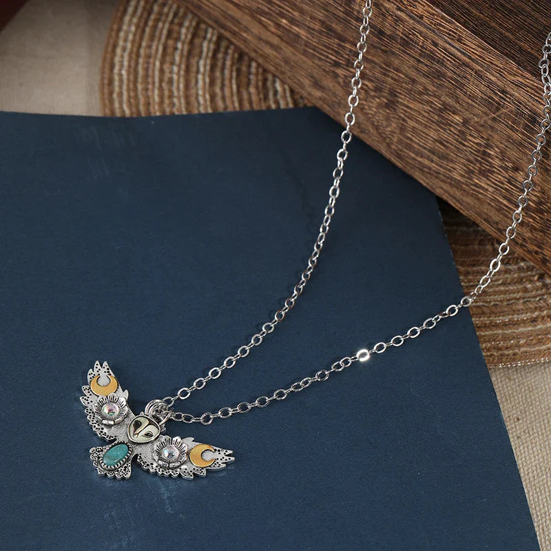 Side view of the owl charm showcasing its intricate design