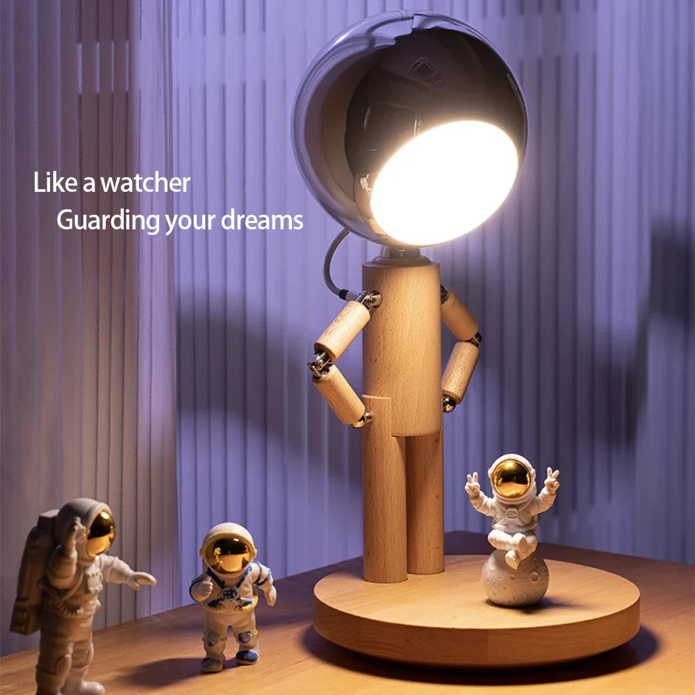 Adjustable wooden astronaut lamp on a desk