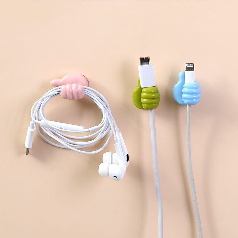 A collection of colorful thumbs-up wall hooks as a lifestyle present