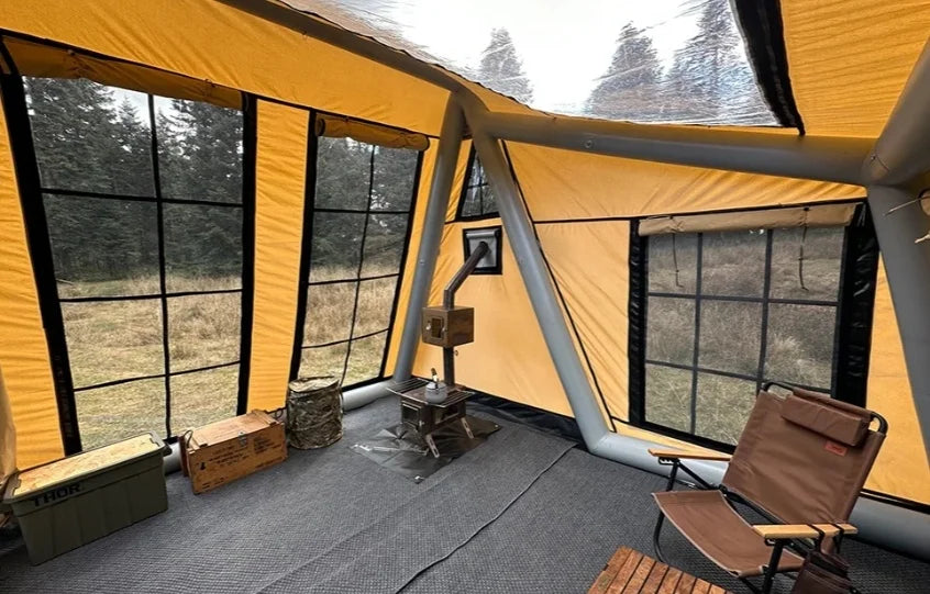 A family enjoying the Wild Escape waterproof tent in a scenic outdoor setting