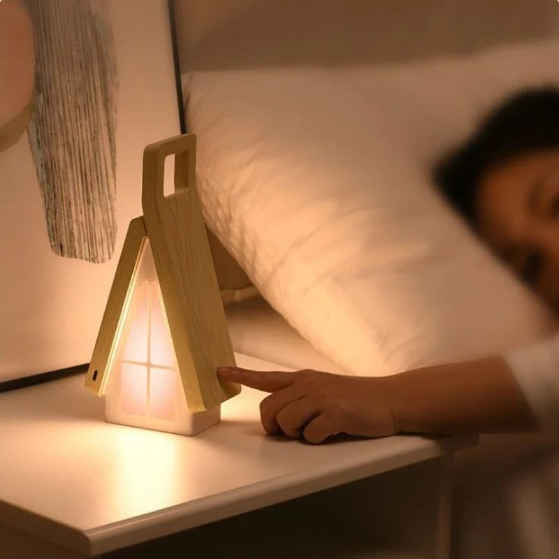 Foldable table lamp glowing warmly at night creating a cozy atmosphere