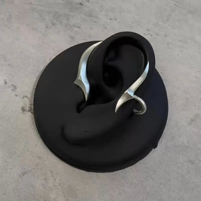 Side profile showcasing the elegant curve of the Night Arc Ear Cuff on a model's ear.