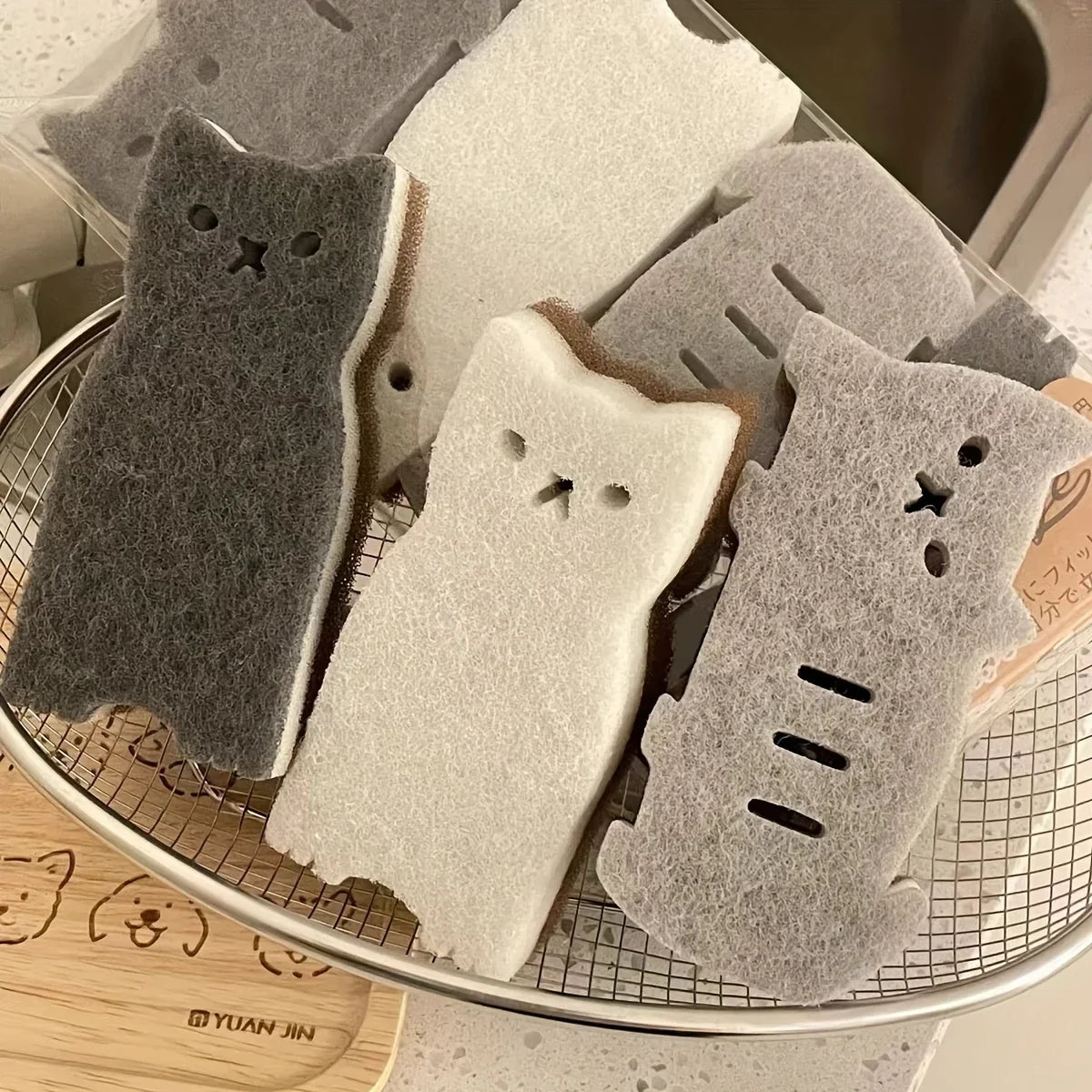 A cute black cat-shaped cleaning sponge as a unique gift idea
