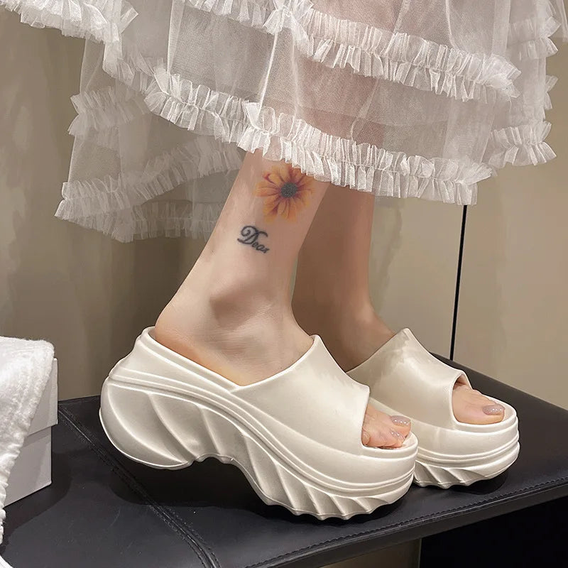 A pair of the High Heel Soft Sole Platform Slippers in white