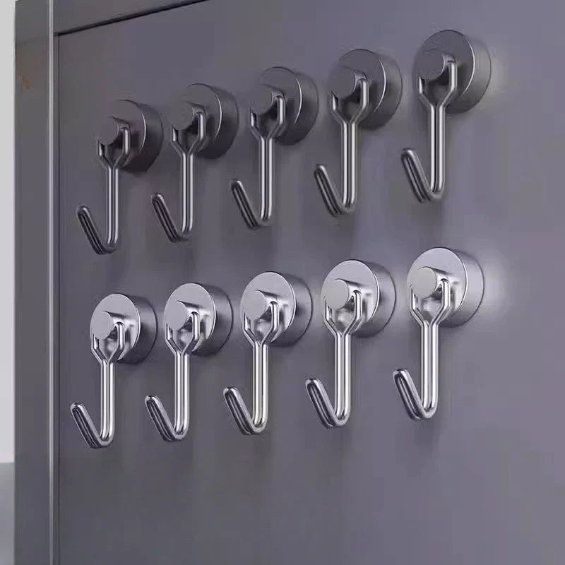 A person demonstrating the strong magnetic grip of the wall hook