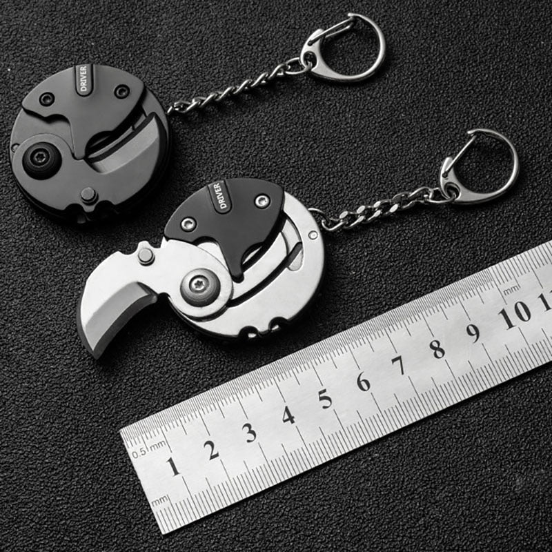 Mini Hiking Survival Keychain Tool attached to a backpack zipper for easy access