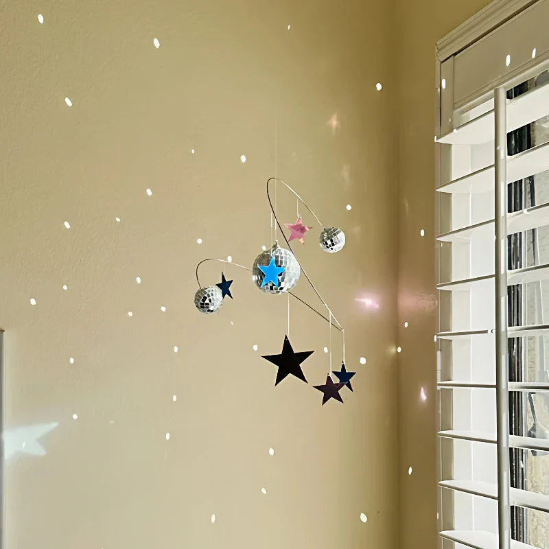 Detailed view of the durable resin material of the Planet Stars Wind Chime
