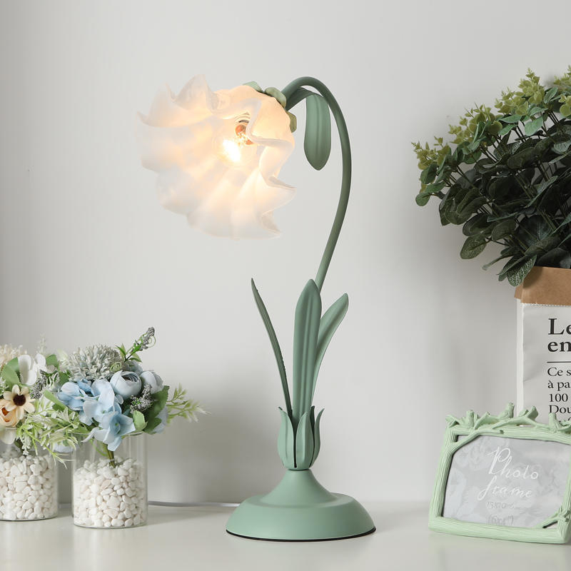 Lifestyle image of the Flower Charm Nordic Style Table Lamp on a bedside table